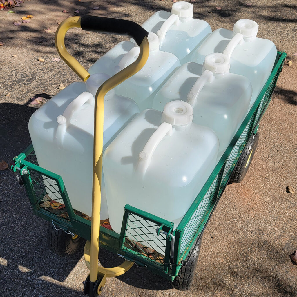 6 five gallon water jugs can fit on a typical garden cart.